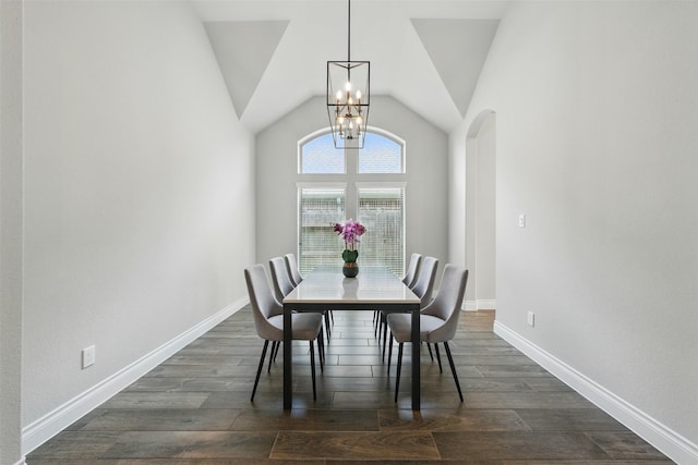 1722 Country Air Ln, Missouri City, TX 77459 - dining area featuring a chandelier, dark wood-style flooring, lofted ceiling, baseboards, and arched walkways