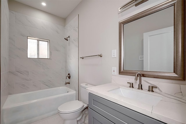 bathroom with toilet, vanity, and shower / bathtub combination