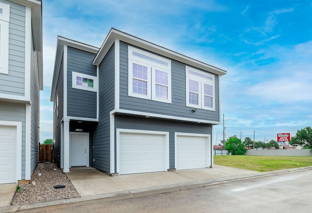 18830 Elegance Ave, Spring, TX 77379 - view of front of home with a garage and fence