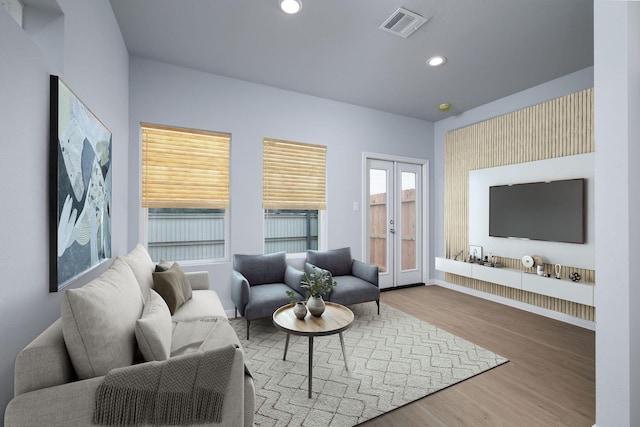 18830 Elegance Ave, Spring, TX 77379 - living room with wood finished floors, recessed lighting, baseboards, and french doors