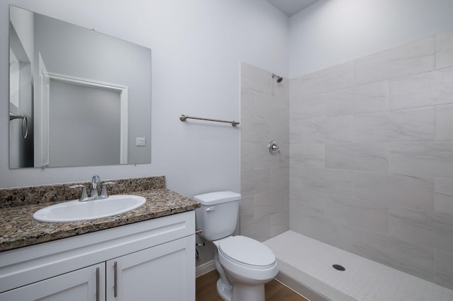 18830 Elegance Ave, Spring, TX 77379 - full bath with vanity, tiled shower, toilet, and wood finished floors