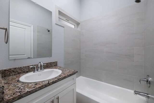 18830 Elegance Ave, Spring, TX 77379 - bathroom featuring tub / shower combination and vanity