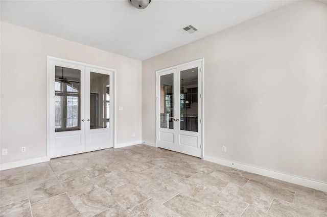 23335 Robinson Pond Dr, New Caney, TX 77357 - empty room featuring french doors and baseboards