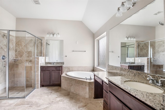 23335 Robinson Pond Dr, New Caney, TX 77357 - full bathroom with a shower stall, a garden tub, lofted ceiling, and two vanities