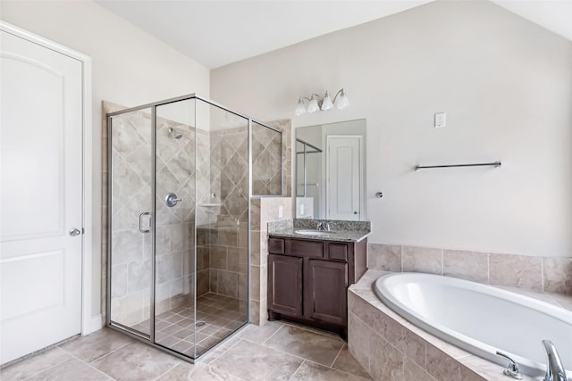23335 Robinson Pond Dr, New Caney, TX 77357 - bathroom with a shower stall, a garden tub, vanity, and tile patterned floors