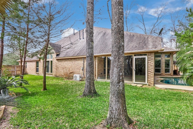 23335 Robinson Pond Dr, New Caney, TX 77357 - rear view of house featuring brick siding, an outdoor pool, and a shingled roof