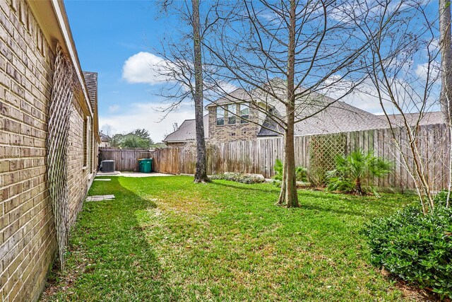 23335 Robinson Pond Dr, New Caney, TX 77357 - view of yard featuring central AC unit and a patio area