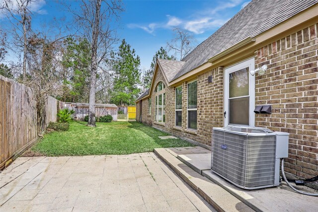 23335 Robinson Pond Dr, New Caney, TX 77357 - view of yard featuring central air condition unit and a patio
