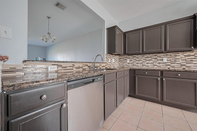 4918 Alder Bend Ln, Richmond, TX 77469 - kitchen with stainless steel dishwasher, backsplash, a chandelier, light tile patterned floors, and a sink