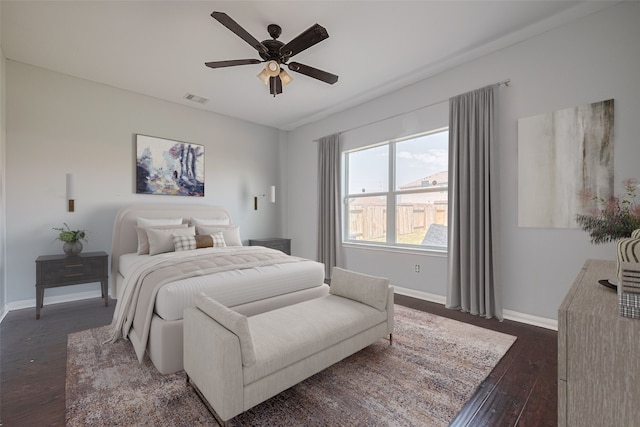 4918 Alder Bend Ln, Richmond, TX 77469 - bedroom featuring dark wood finished floors, baseboards, and ceiling fan