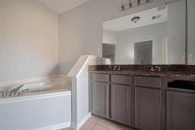 4918 Alder Bend Ln, Richmond, TX 77469 - bathroom with tile patterned flooring, a bath, and double vanity