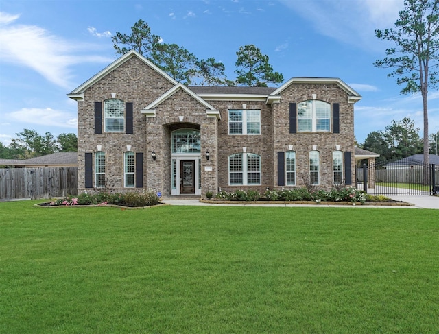14414 Spring Mountain Dr, Tomball, TX 77377 - view of front of house with brick siding and a gate