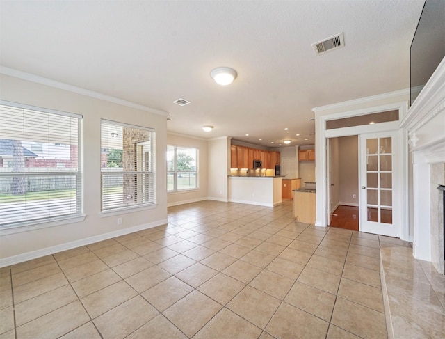 14414 Spring Mountain Dr, Tomball, TX 77377 - unfurnished living room featuring ornamental molding, light tile patterned flooring, french doors, baseboards, and recessed lighting