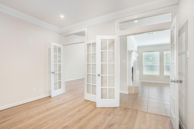 14414 Spring Mountain Dr, Tomball, TX 77377 - empty room with french doors, crown molding, wood finished floors, baseboards, and recessed lighting
