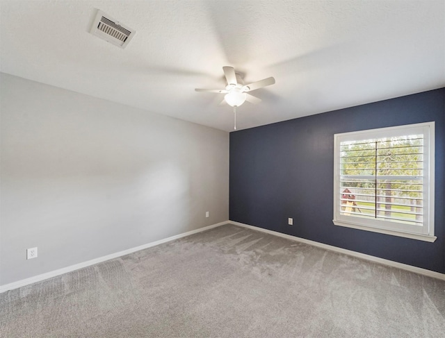 14414 Spring Mountain Dr, Tomball, TX 77377 - spare room with a ceiling fan, carpet flooring, and baseboards