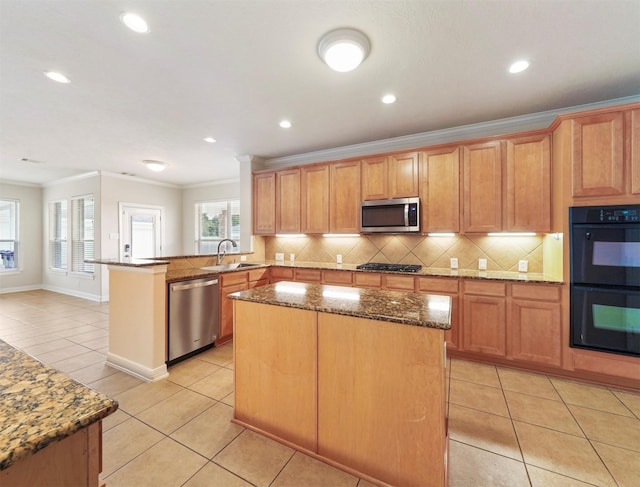 14414 Spring Mountain Dr, Tomball, TX 77377 - kitchen with appliances with stainless steel finishes, a sink, ornamental molding, light tile patterned flooring, and a peninsula