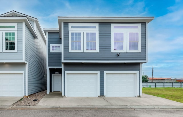 18832 Elegance Ave, Spring, TX 77379 - view of front of property featuring a garage, fence, and concrete driveway