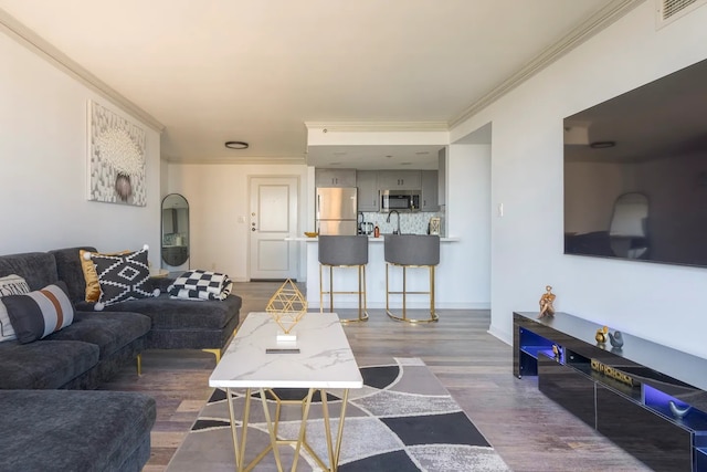 3525 Sage Rd Unit 1105, Houston, TX 77056 - living area featuring wood finished floors, crown molding, and baseboards