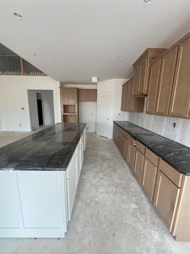 2213 Sonder Shore Dr, Katy, TX 77493 - kitchen featuring dark stone counters and a large island