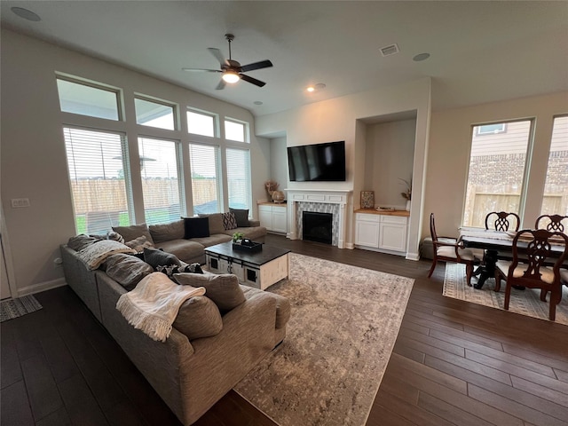 7426 Water Glen Ln, Manvel, TX 77578 - living area with ceiling fan, a fireplace, dark wood-style flooring, and baseboards