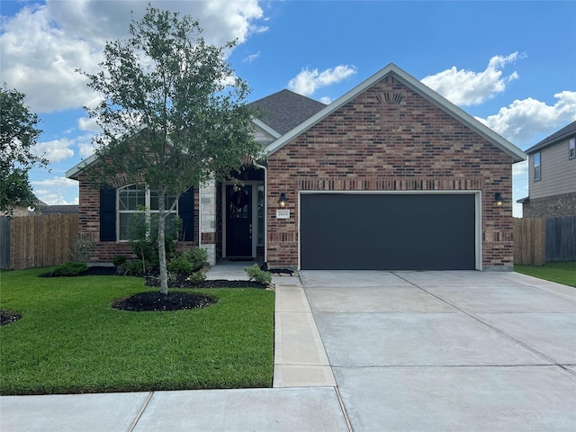 7426 Water Glen Ln, Manvel, TX 77578 - view of front of home with concrete driveway, brick siding, and a garage