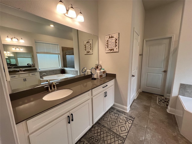 7426 Water Glen Ln, Manvel, TX 77578 - full bathroom with a bathtub, vanity, and baseboards