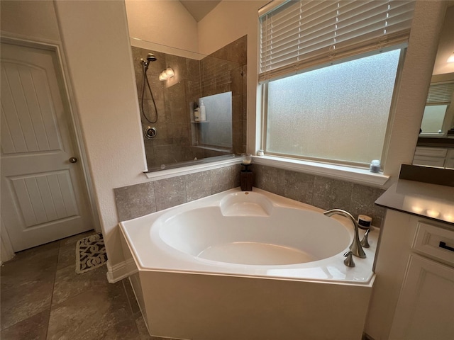 7426 Water Glen Ln, Manvel, TX 77578 - bathroom with a bath and tiled shower