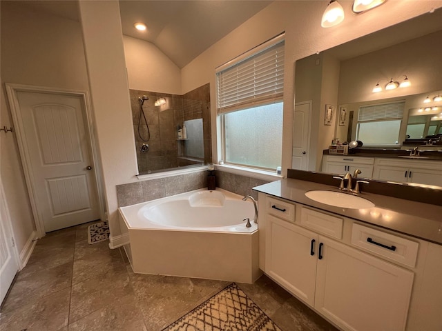 7426 Water Glen Ln, Manvel, TX 77578 - bathroom featuring a walk in shower, a bath, vaulted ceiling, and vanity