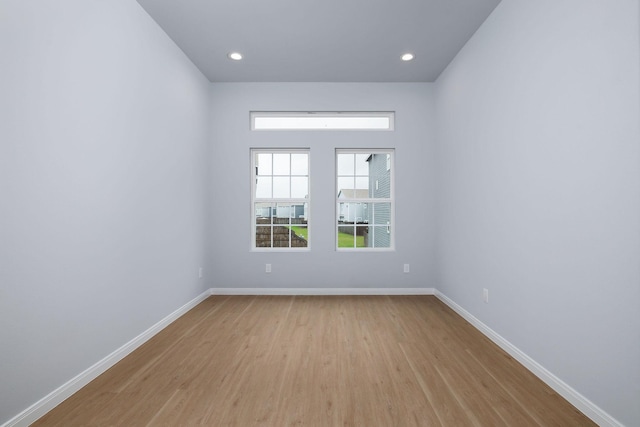 18834 Elegance Ave, Spring, TX 77379 - spare room featuring light wood-style floors, baseboards, and recessed lighting
