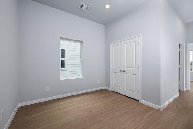 18834 Elegance Ave, Spring, TX 77379 - unfurnished bedroom with light wood finished floors, baseboards, and recessed lighting