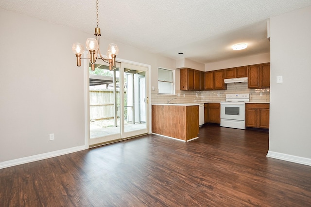 5809 Village Forest Ct, Houston, TX 77092 - kitchen with white appliances, under cabinet range hood, light countertops, decorative backsplash, and a textured ceiling
