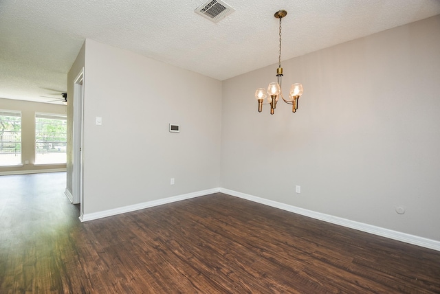 5809 Village Forest Ct, Houston, TX 77092 - empty room featuring dark wood finished floors, a chandelier, baseboards, ceiling fan, and a textured ceiling