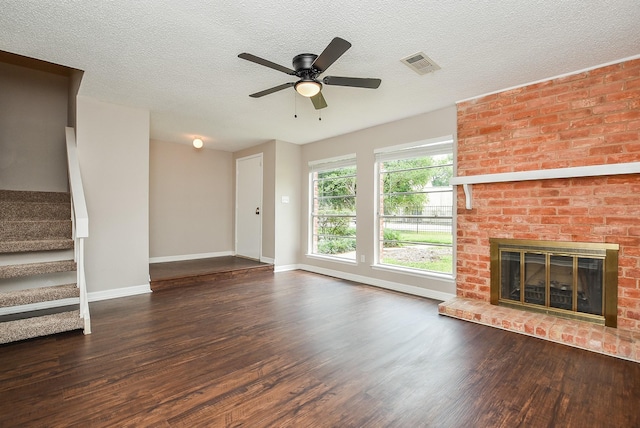 5809 Village Forest Ct, Houston, TX 77092 - unfurnished living room featuring wood finished floors, baseboards, ceiling fan, stairs, and a fireplace