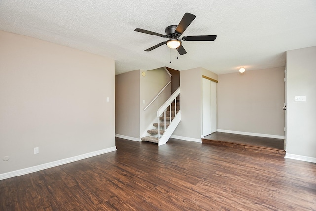 5809 Village Forest Ct, Houston, TX 77092 - spare room with a ceiling fan, wood finished floors, stairway, a textured ceiling, and baseboards