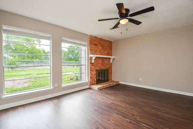 5809 Village Forest Ct, Houston, TX 77092 - unfurnished living room with baseboards, dark wood finished floors, and a brick fireplace