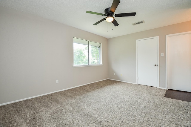 5809 Village Forest Ct, Houston, TX 77092 - carpeted empty room with a ceiling fan, baseboards, and a textured ceiling