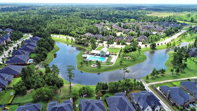 17786 Tree Of Heaven, Conroe, TX 77385 - aerial view of property's location featuring nearby suburban area, a large body of water, and a heavily wooded area