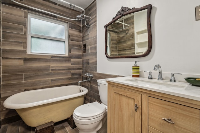 507 Silverdale Dr, Conroe, TX 77301 - bathroom featuring toilet, a soaking tub, vanity, and a shower