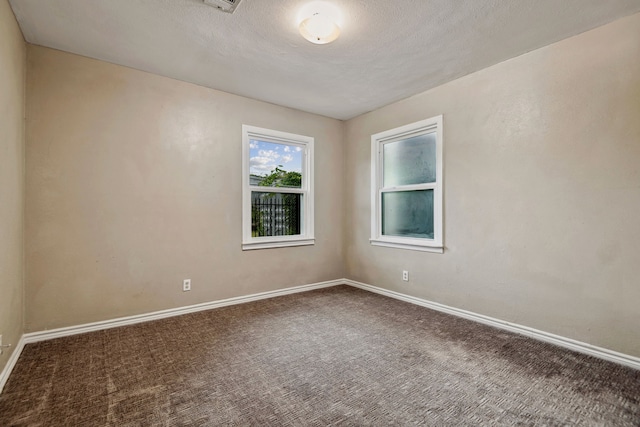 507 Silverdale Dr, Conroe, TX 77301 - unfurnished room featuring carpet, baseboards, and a textured ceiling