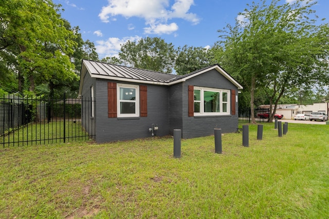 507 Silverdale Dr, Conroe, TX 77301 - view of side of property featuring metal roof and a standing seam roof