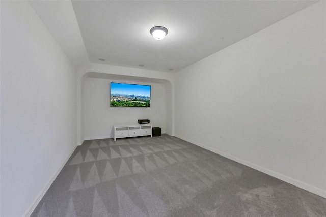 carpeted spare room with baseboards