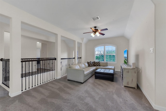 living room featuring ceiling fan, carpet flooring, baseboards, and lofted ceiling