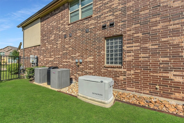 view of side of home with central AC unit