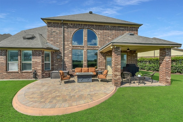 rear view of house with an outdoor hangout area, a patio, brick siding, and a lawn