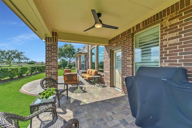 view of patio featuring an outdoor living space, grilling area, and a ceiling fan