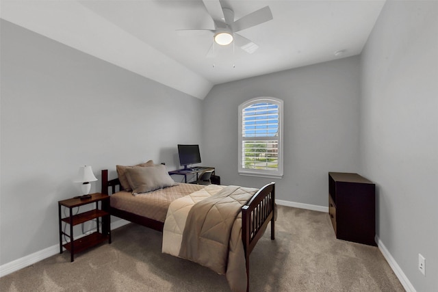carpeted bedroom featuring baseboards, a ceiling fan, and vaulted ceiling