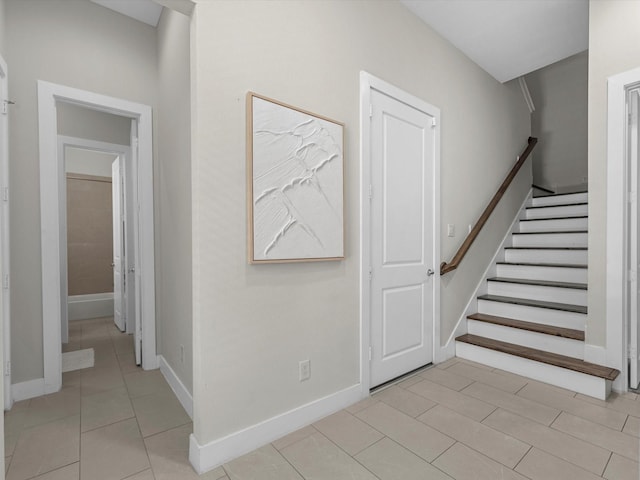 110 N Hutcheson St, Houston, TX 77003 - stairs featuring baseboards and tile patterned flooring