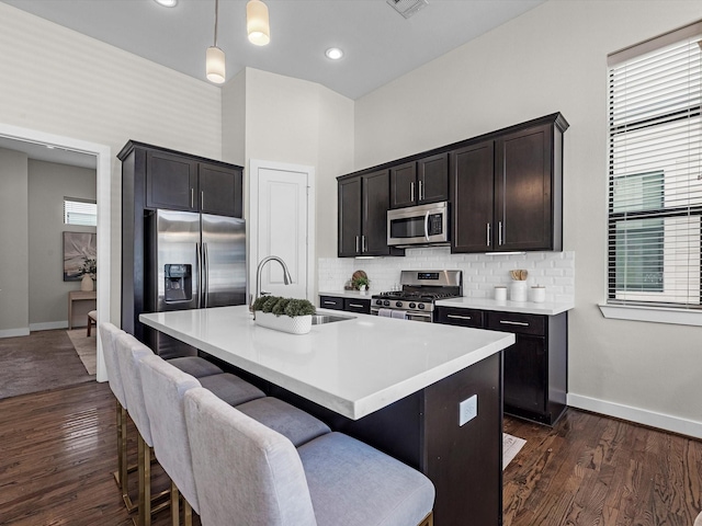 110 N Hutcheson St, Houston, TX 77003 - kitchen with appliances with stainless steel finishes, a sink, baseboards, tasteful backsplash, and recessed lighting