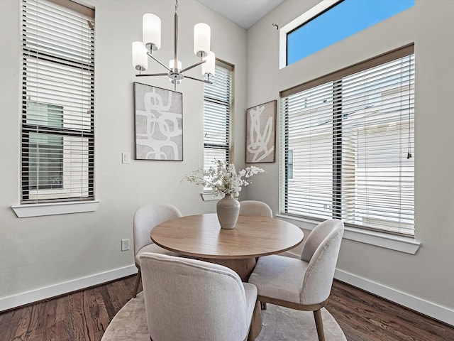 110 N Hutcheson St, Houston, TX 77003 - dining space with a chandelier, baseboards, and dark wood-style flooring
