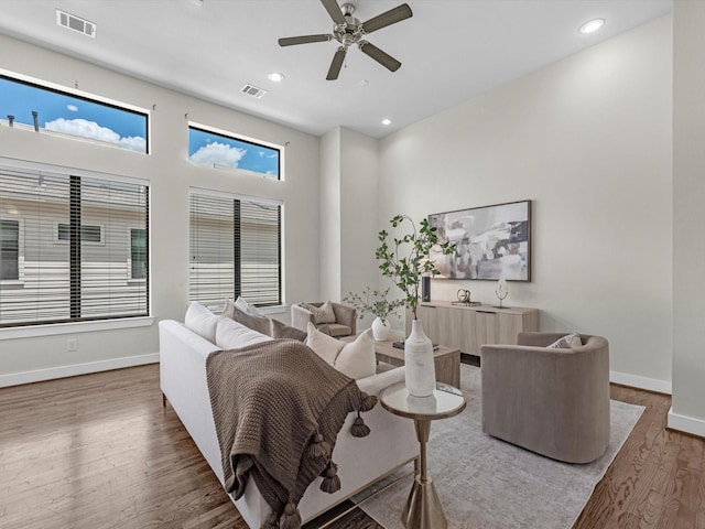 110 N Hutcheson St, Houston, TX 77003 - living room with wood finished floors, a ceiling fan, baseboards, and recessed lighting